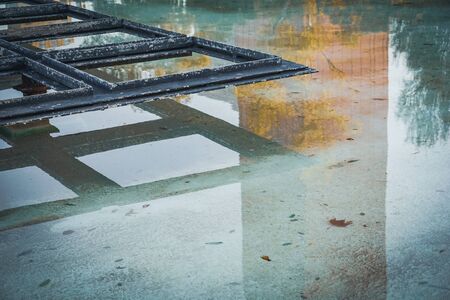 Metallic ornamental structure located in the middle of a pondの写真素材