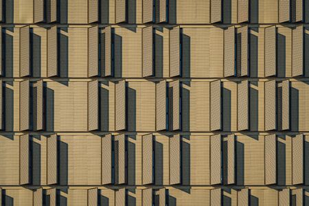 Modern building facade full of window shuttersの写真素材