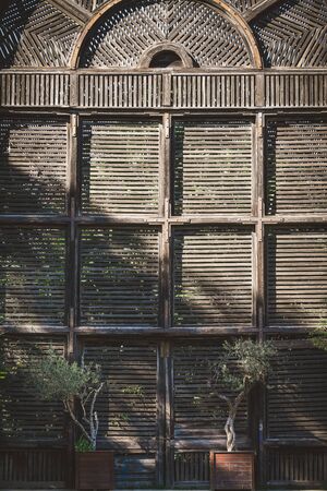 Old wooden shutter doors of a Lath Houseの写真素材