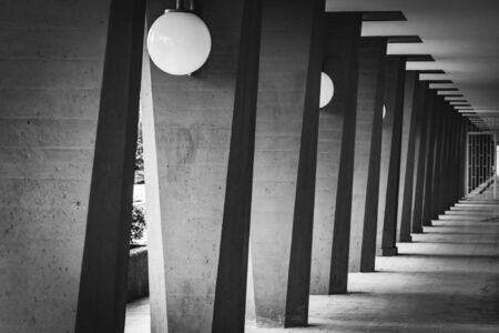 Outdoor hallway with columns in black and whiteの写真素材