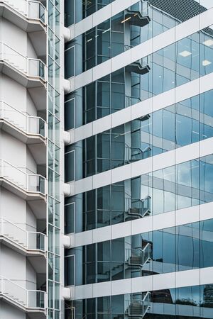 Outdoor stairs and glass facade of an office buildingの写真素材