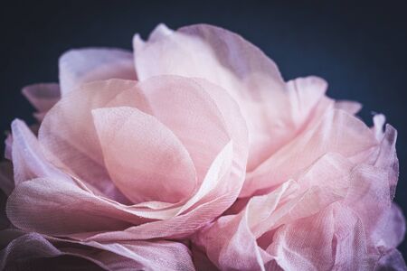 Detail of the pink petals of a rose made of fabricの写真素材