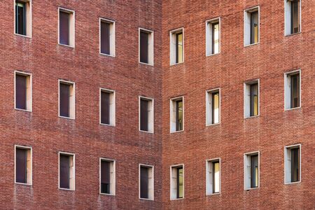 Symmetrical facades of an old brick buildingの写真素材