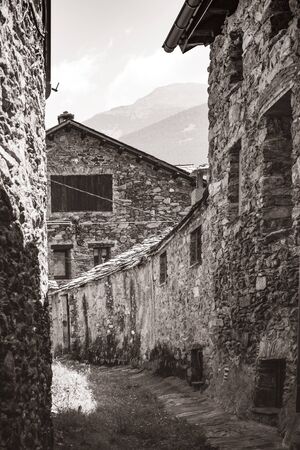 Typical and traditional old houses of the Pyrenees build with stone walls and wooden window shuttersの写真素材