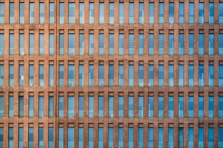 Uniform facade of an office buildingの写真素材