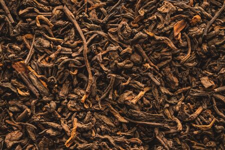 Close-up of dried black tea leaves with cinnamonの写真素材
