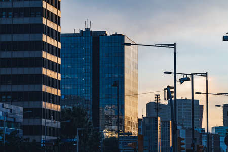 Afternoon lights reflected on the glass facade of different office buildingsのeditorial素材