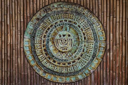 A detailed piece of Hawaiian art on a bamboo wallの写真素材