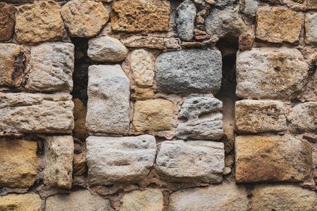 Historical stone wall built with natural calcareous rocks-blocksの写真素材