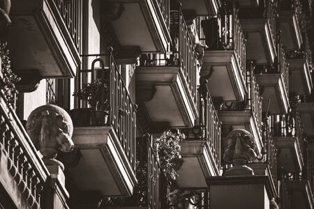 Low angle view of rows of neoclassical balconies on the facade of a residential buildingの写真素材