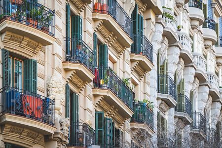Low angle view of rows of neoclassical balconies on the facade of a residential buildingの写真素材