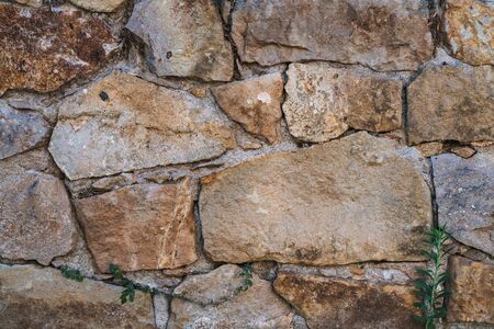 Texture of an old wall made of natural stonesの写真素材