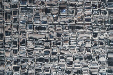 Macro detail of the texture of a decorative glass brickの写真素材