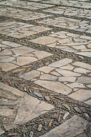 Stone floor decorated with river boulders and natural limestoneの写真素材