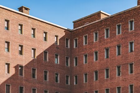 Symmetrical facades of an old brick buildingの写真素材