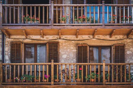 Wooden balconies of the facade of a traditional rural houseの写真素材