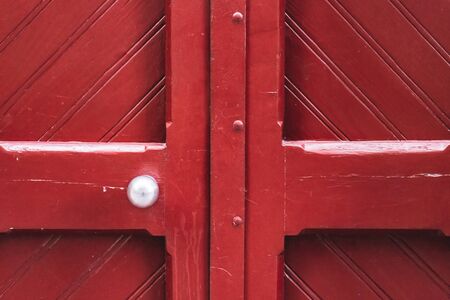 Detail of a traditional vintage red wooden doorの写真素材