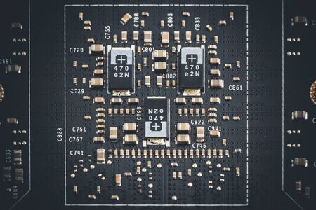 Macro view of electronic components of the printed circuit board of a graphics cardの写真素材