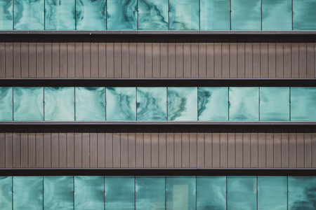 Frontal view of the glazed windows of the facade of an office buildingの写真素材