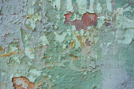 Texture of an old wall with greenish peeling paintの写真素材