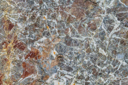 Texture of the surface of a veined marble in brown and grey tonesの写真素材