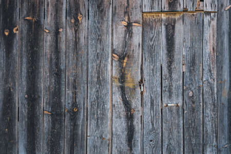Detail of an old rustic wooden door of a country houseの写真素材