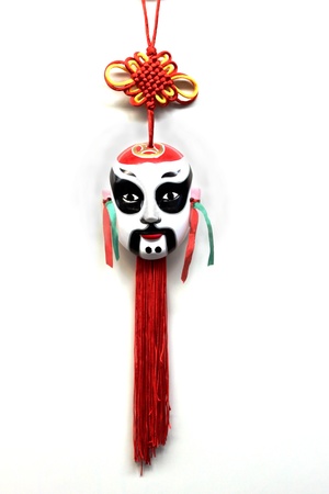 White Korean mask with red and yellow tasselsの写真素材
