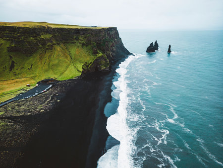 Reynisdrangar rocks on coastline of Reynisfjara black beach, Icelandの写真素材