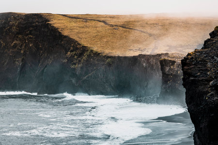 Wawes crashing on the shore of Reynisfjara beachの写真素材