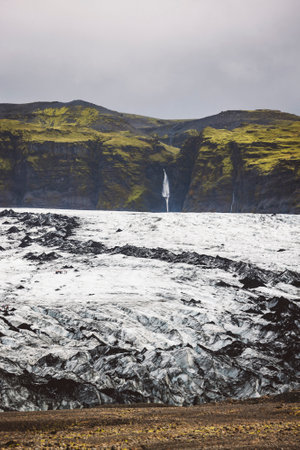 Fantastic view on Solheimajokull glacier waterfall behindの写真素材