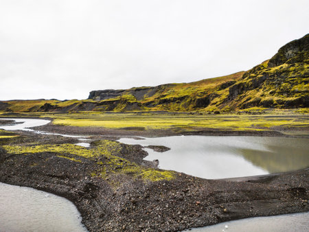 Iceland landscape, glacier lakes, mountains behind, overcast weatherの写真素材