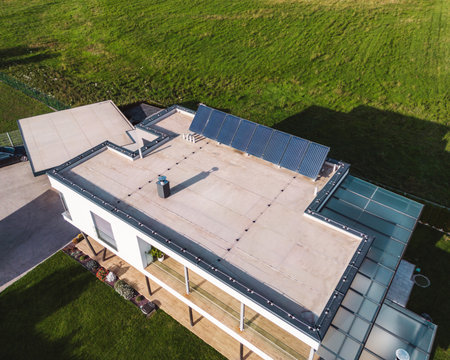 Modern family home, view from the air with solar panels on the roof topの写真素材