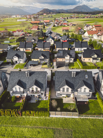 Vertical photo, aerial view of new houses, family homes in the suburbs of Sloveniaの写真素材