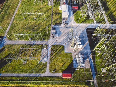 Top down aerial view, right above electrical power substation in the countryside