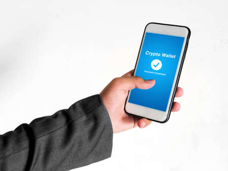 Payment Completed From Crypto Wallet Concept Background with Young man holding mobile. Pay with...