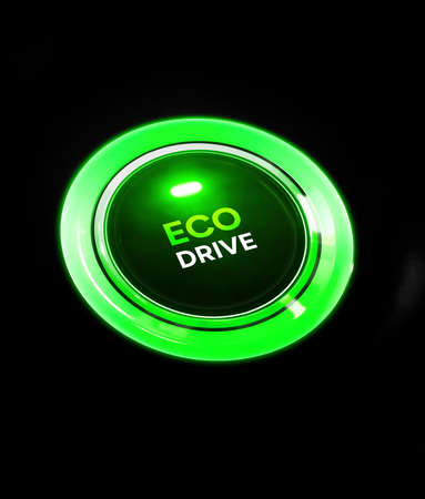 Green button on a black background.の写真素材