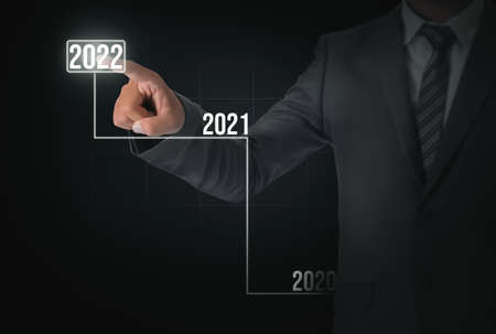 New Year 2022 Abstract Technological Background Wallpaper with Man touching on the screen