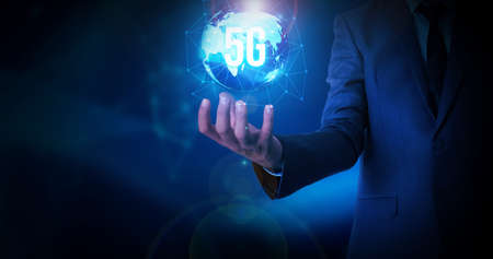 5G Internet Globe Glowing in the Hand of Business Man with Free Copy Space. Abstract Futuristic...