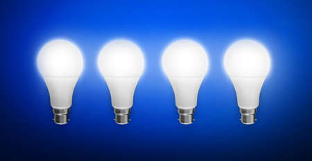 Four Glowing Bulb on Abstract Blue Space Background. Modern futuristic and Ideas concept wallpaper 3d renderedの写真素材