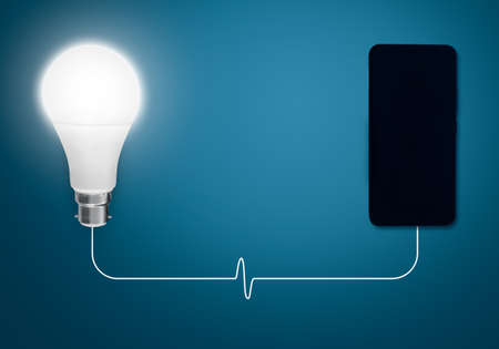 Smartphone and Light Bulb on Blue Background. 3d Rendering