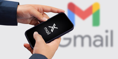 Person Using X mail on Mobile Smartphone with Blur Gmail in the backdrop, Tech News Editorial...