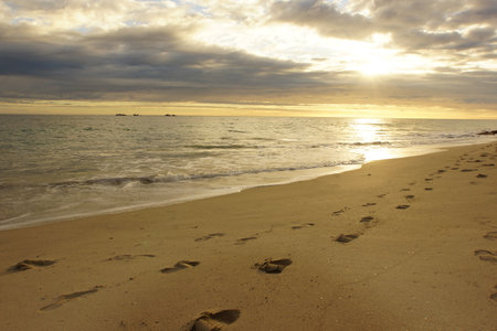 Sand footprints beach sceneの写真素材