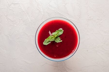 Russian national drink cranberry jelly with mint on a light background top view. Organic foodの写真素材