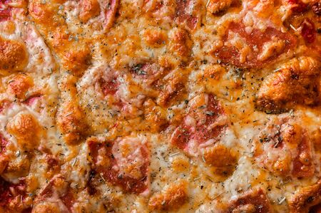 Pizza with mozzarella and salami close-up. Food background conceptの写真素材