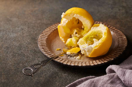 Original dessert fruit lemon according to the idea of French confectioners broken in half - cream...