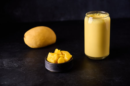 Lassi is popular refreshment cold drink with yogurt, mango, water, spices and ice. Traditional...