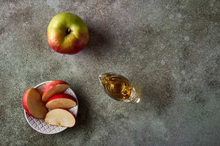 Apples slices on plate, apple fruit and juice on rustic wooden background. Top view. Copy spaceの写真素材