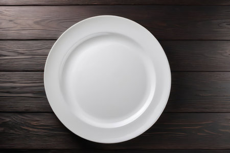 Empty white plate on brown rustic wooden background, flat lay. Generative AIの素材