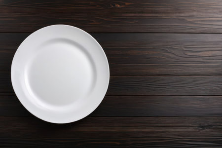 Empty white plate on brown rustic wooden background, flat lay. Generative AIの素材