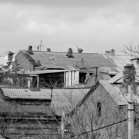 Roofs of old residential buildings in Russia